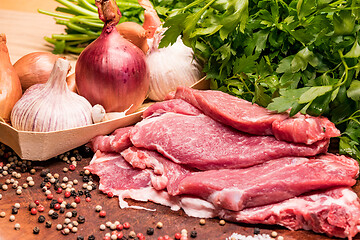 Image showing Raw pork ribs in the loin on a wooden board