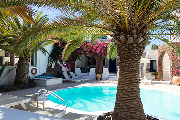 Image showing private pool and sun loungers in the sun