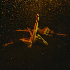 Image showing Two young female ballet dancers under water drops