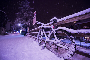Image showing parked bicycle covered by snow