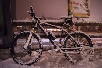 Image showing parked bicycle covered by snow