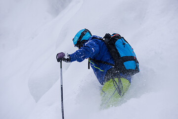 Image showing freeride skier skiing downhill