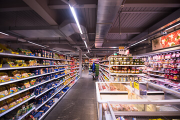 Image showing Man shopping in modern supermarket