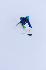 Image showing freeride skier skiing downhill