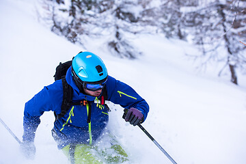 Image showing freeride skier skiing downhill