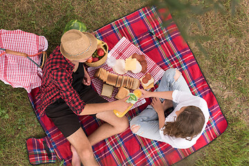 Image showing top view of couple enjoying picnic time