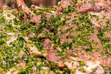 Image showing raw meats marinated in garlic olive oil parsley salt pepper