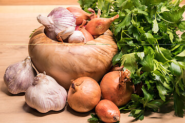 Image showing garlic onion shallot parsley with pestle and olive wood mortar