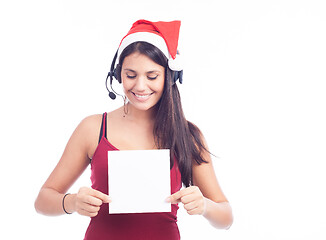 Image showing Christmas phone operator woman showing blank signboard