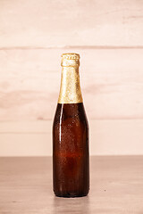 Image showing a bottle of blonde beer with golden paper