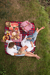 Image showing top view of couple enjoying picnic time