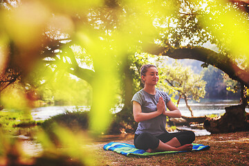 Image showing woman meditating and doing yoga exercise