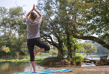 Image showing woman meditating and doing yoga exercise