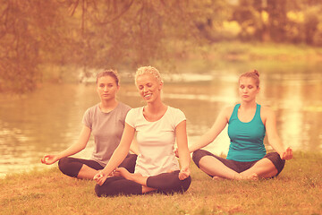 Image showing women meditating and doing yoga exercise