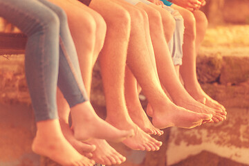 Image showing people sitting at wooden bridge