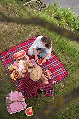 Image showing top view of couple enjoying picnic time