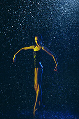 Image showing Two young female ballet dancers under water drops