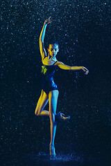 Image showing Two young female ballet dancers under water drops