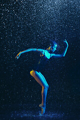 Image showing Two young female ballet dancers under water drops