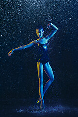 Image showing Two young female ballet dancers under water drops