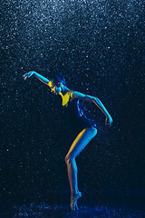 Image showing Two young female ballet dancers under water drops