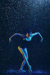 Image showing Two young female ballet dancers under water drops