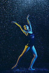 Image showing Two young female ballet dancers under water drops