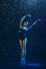 Image showing Two young female ballet dancers under water drops