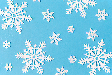 Image showing white snowflake decorations on blue background