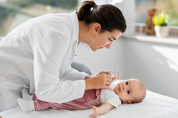 Image showing female pediatrician doctor with baby at clinic