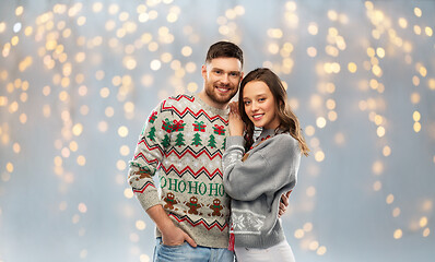 Image showing happy couple at christmas ugly sweater party