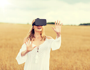 Image showing woman in virtual reality headset on cereal field