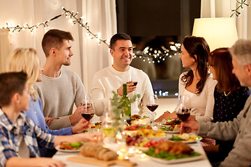 Image showing happy family having dinner party at home