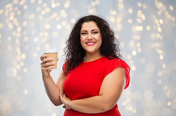 Image showing woman in red dress holding takeaway coffee cup