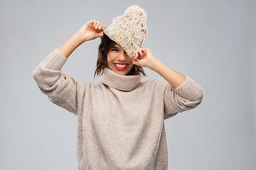 Image showing young woman in knitted winter hat and sweater