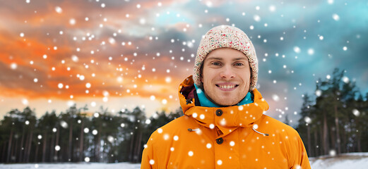 Image showing happy young man in winter clothes outdoors