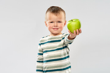 Image showing portrait of smiling boy holding green apple