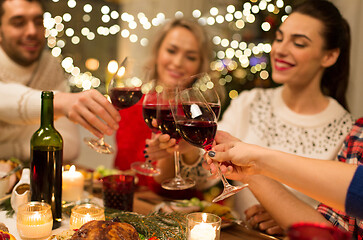 Image showing close up of friends with wine celebrate christmas