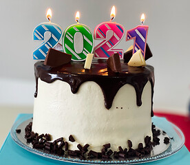 Image showing New Year cake 2021 with colourful candles