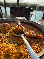 Image showing Delicious traditional paella served in El Palmar, Spain