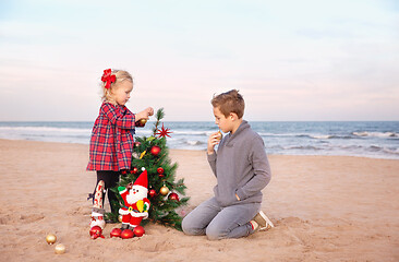 Image showing Getting ready for Christmas holidays. Family party on the beach