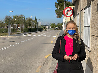 Image showing Alone in empty street. Urban portrait of a woman in mask