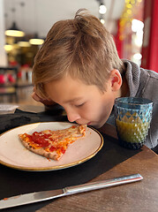 Image showing He can eat pizza without hands