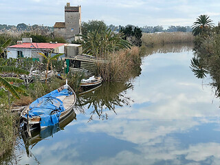 Image showing Village scene with abandoned house and boats. El Palmar, Spain