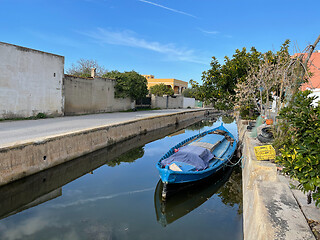 Image showing El Palmar scene with boat moored in the channel, Spain