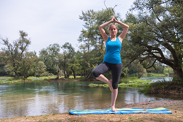 Image showing woman meditating and doing yoga exercise