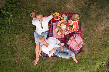 Image showing top view of couple enjoying picnic time