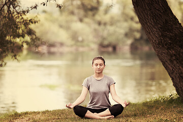 Image showing woman meditating and doing yoga exercise