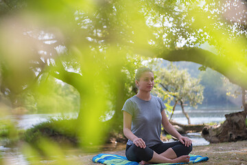 Image showing woman meditating and doing yoga exercise