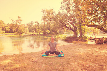 Image showing woman meditating and doing yoga exercise